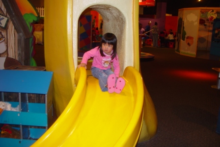 Kasen sliding at the Children's Museum